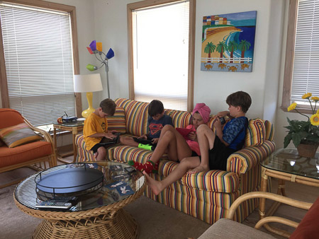 Eddie, Jonah, Ella, and Britt playing games at the beach house