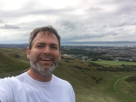Andrew at the top of Arthur's Seat