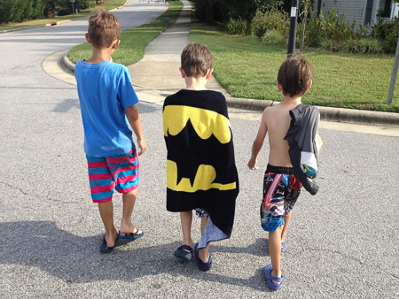 Sam, Noah, and Jonah walking home from the pool