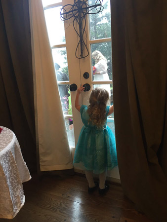 Penny watching the bride and groom getting pictures done