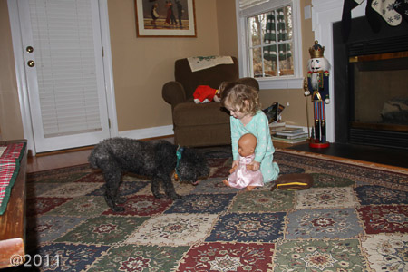 Penny showing the baby doll to Farley
