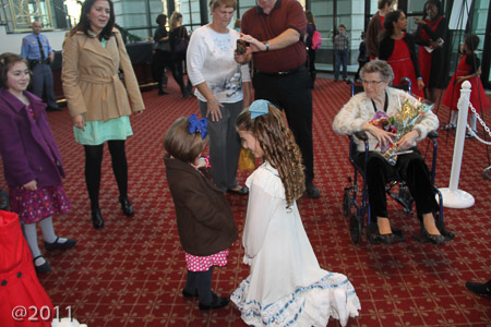 Greeting her fans (Great Grandma Gill in the background)