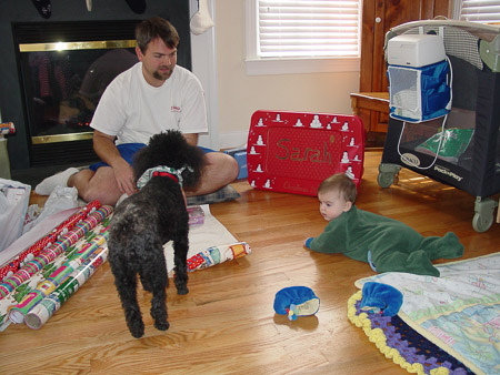 Helping Daddy wrap Christmas presents